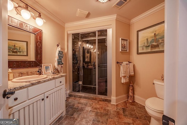 bathroom with crown molding, vanity, and toilet