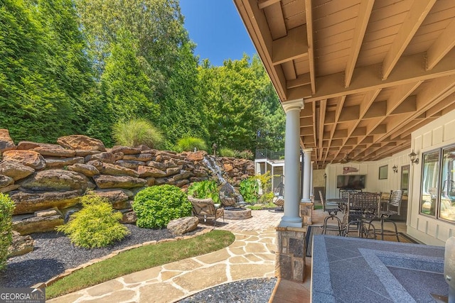 view of patio featuring an outdoor fire pit