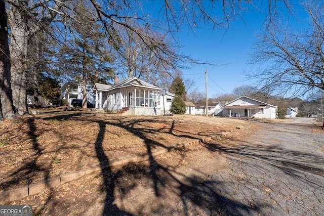 exterior space featuring a sunroom