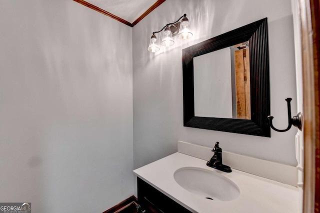 bathroom featuring vanity and crown molding