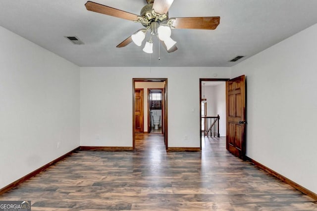 empty room featuring dark wood-type flooring