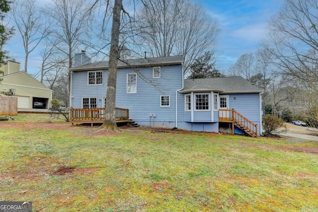 back of property with a deck and a lawn