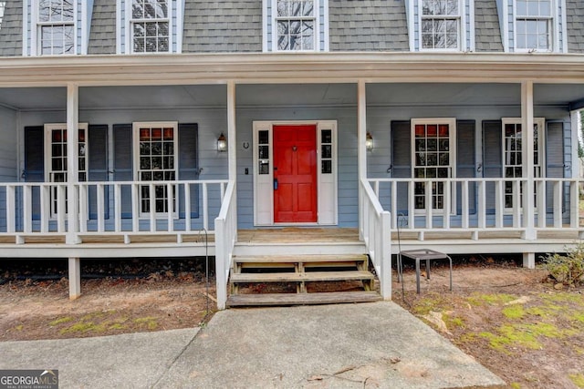 doorway to property featuring a porch