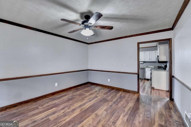 unfurnished room with ornamental molding, ceiling fan, a textured ceiling, and dark hardwood / wood-style flooring