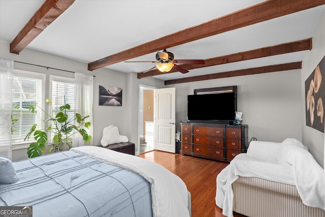 bedroom featuring beamed ceiling, ceiling fan, and light hardwood / wood-style floors