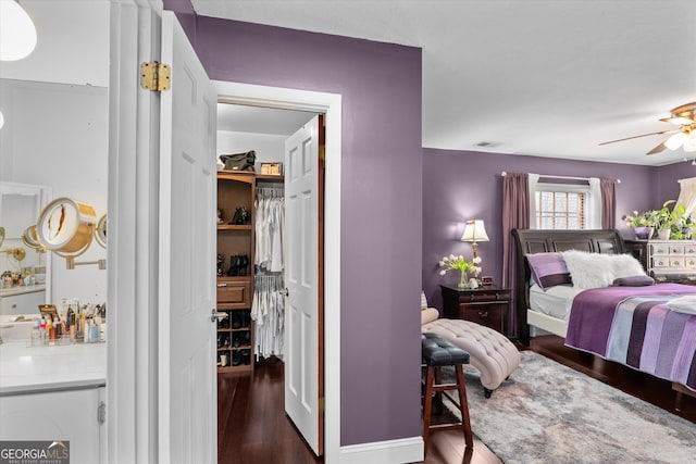 bedroom with dark wood-type flooring and ceiling fan