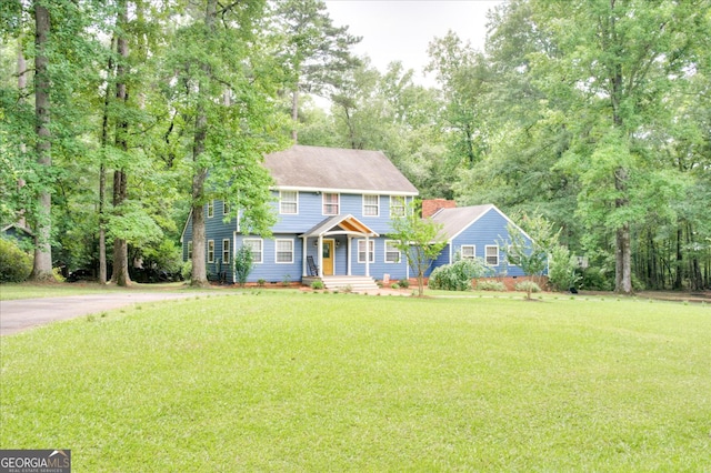 colonial inspired home with a front yard