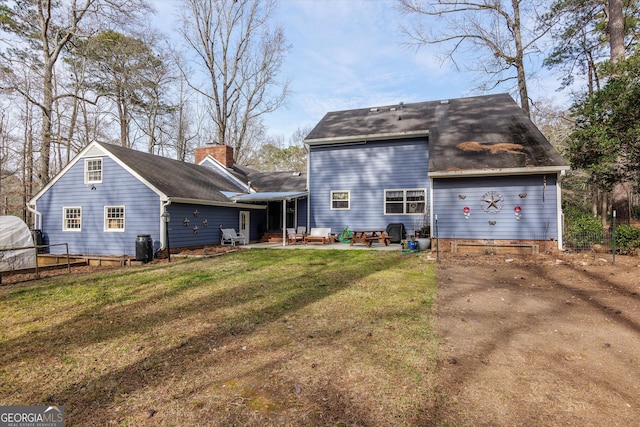 exterior space featuring a yard and a patio area