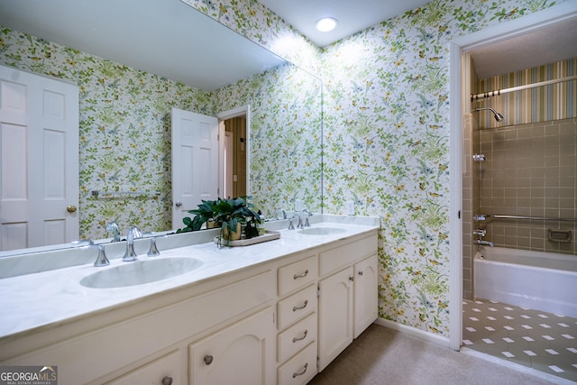 bathroom with vanity and tiled shower / bath