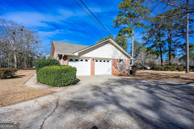 view of side of property featuring a garage