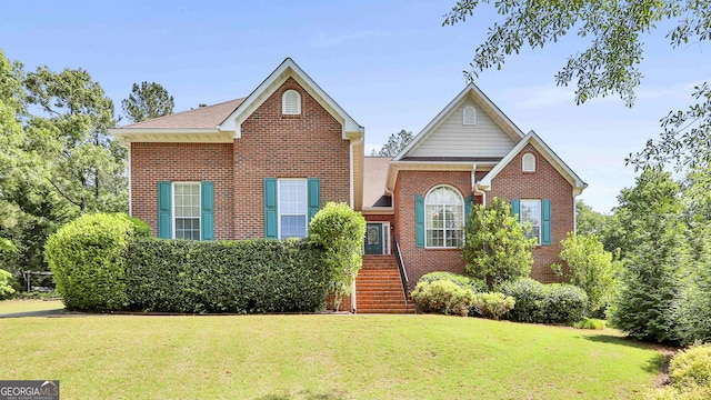 view of property featuring a front lawn