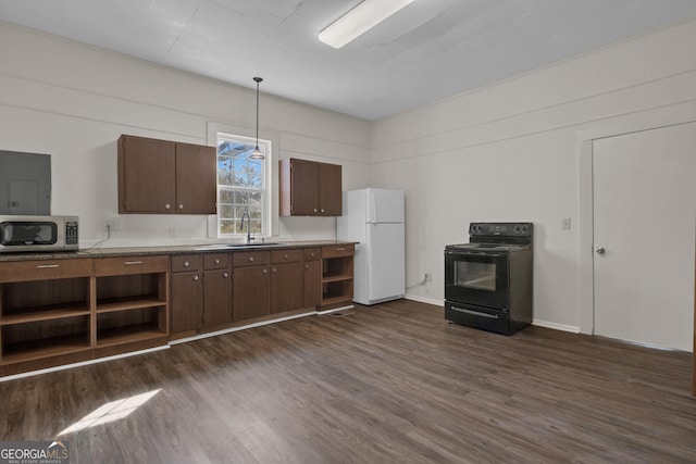 kitchen featuring sink, decorative light fixtures, black electric range, dark hardwood / wood-style floors, and white fridge