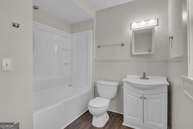 full bathroom featuring wood-type flooring, vanity, shower / bathtub combination, and toilet