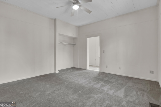 unfurnished bedroom with a closet, ceiling fan, and carpet flooring