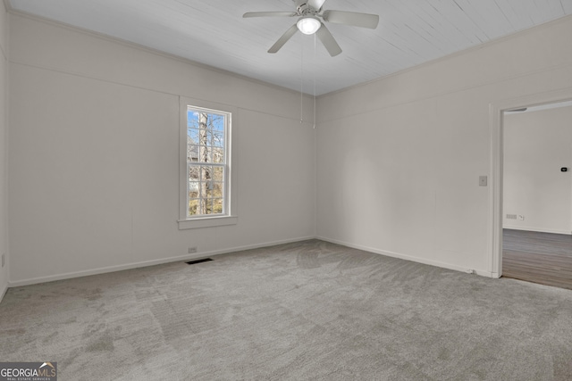 carpeted empty room with ceiling fan