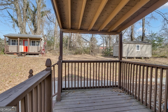 wooden deck featuring a shed