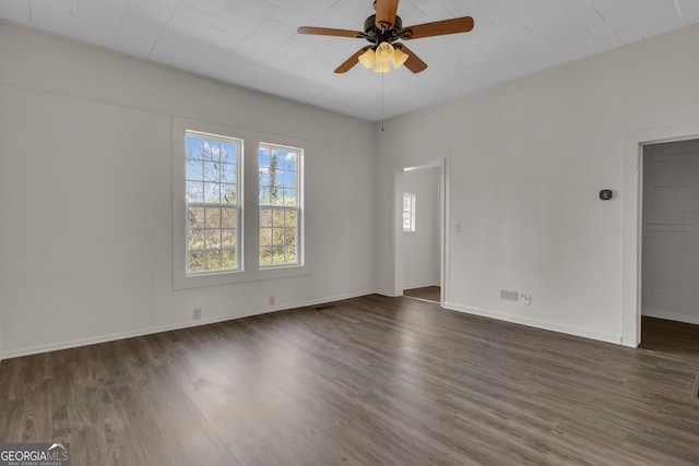 unfurnished room featuring dark hardwood / wood-style flooring and ceiling fan