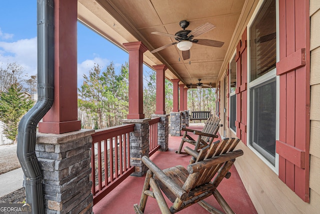 view of patio / terrace with ceiling fan and a porch