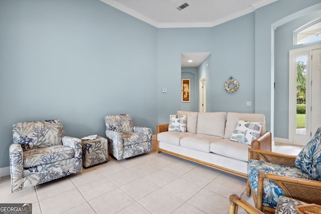 living room with light tile patterned floors and ornamental molding