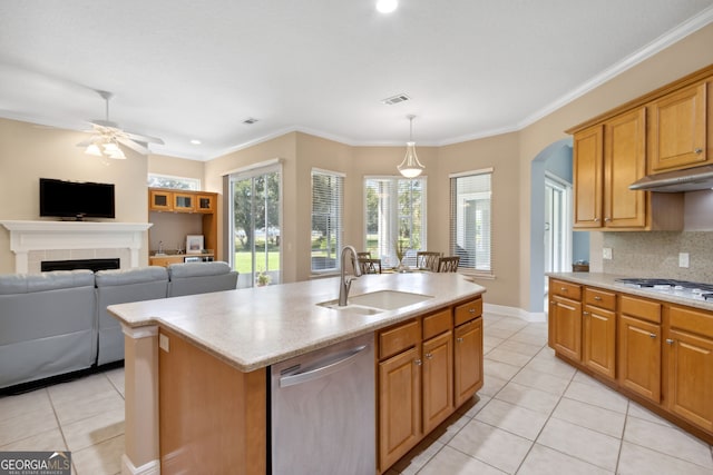 kitchen featuring sink, hanging light fixtures, stainless steel dishwasher, a center island with sink, and white gas cooktop