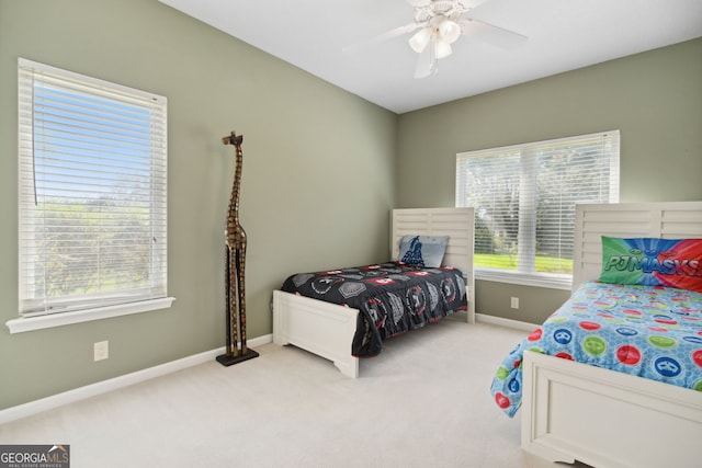 bedroom with ceiling fan and carpet flooring