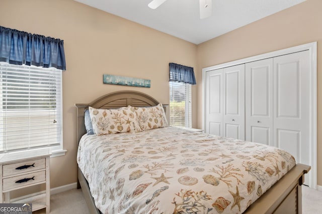 carpeted bedroom with a closet and ceiling fan