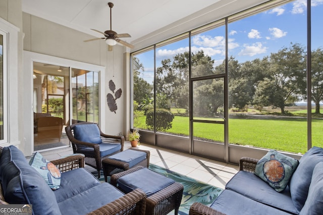 sunroom / solarium with ceiling fan