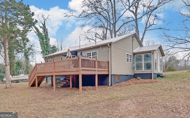 back of house featuring a deck