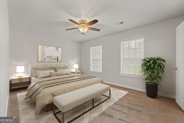 carpeted bedroom with ceiling fan