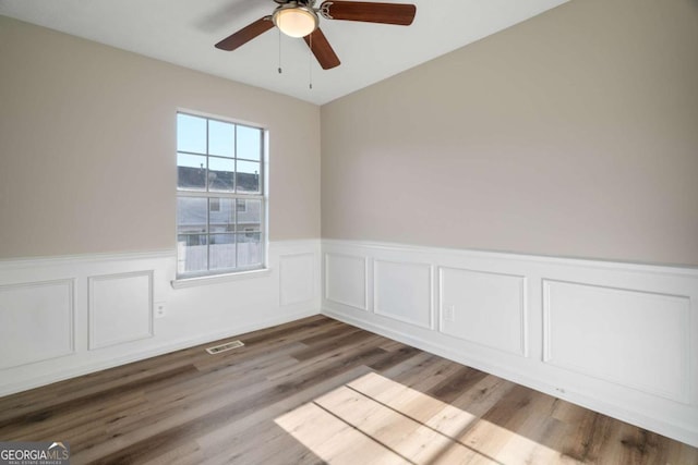 unfurnished room with ceiling fan and light hardwood / wood-style flooring