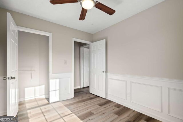 unfurnished bedroom featuring ceiling fan and light hardwood / wood-style floors