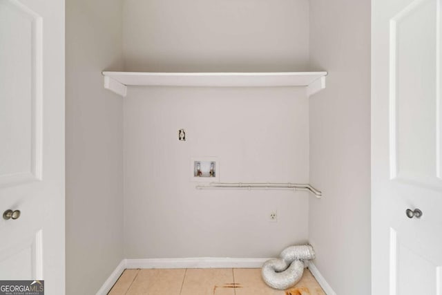 laundry room featuring washer hookup, light tile patterned floors, and electric dryer hookup