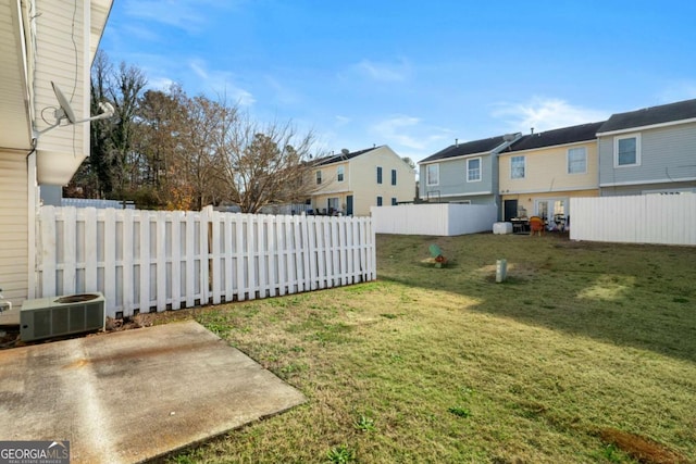 view of yard featuring a patio and central AC