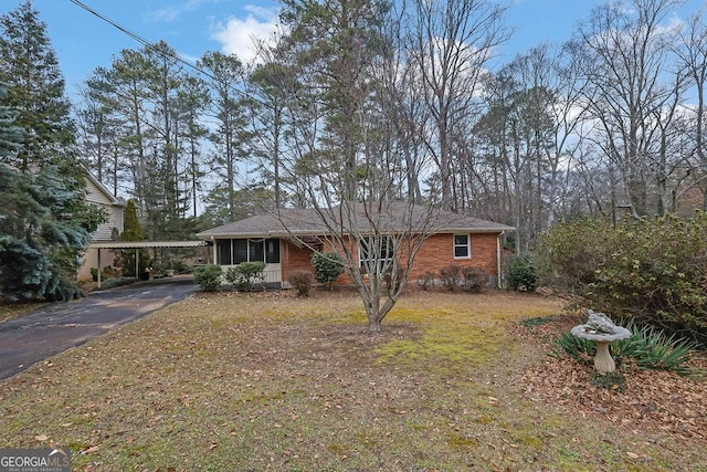 single story home with a carport