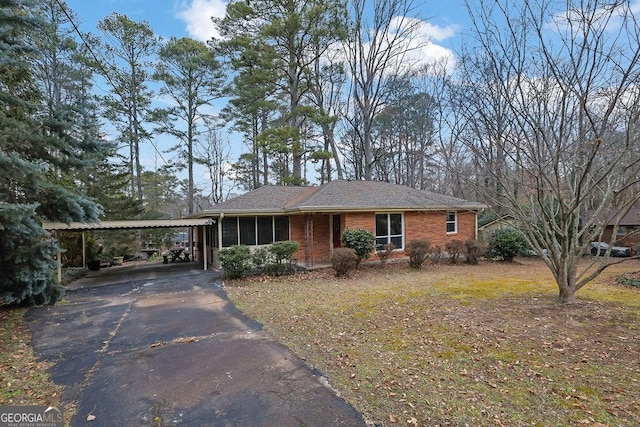 ranch-style house with a carport