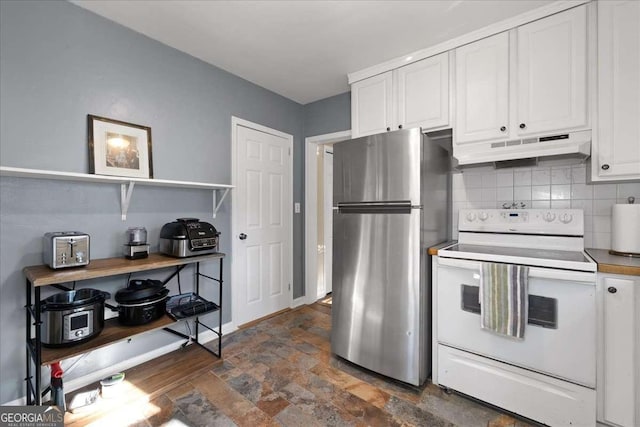 kitchen with stainless steel refrigerator, white cabinetry, white electric stove, and backsplash