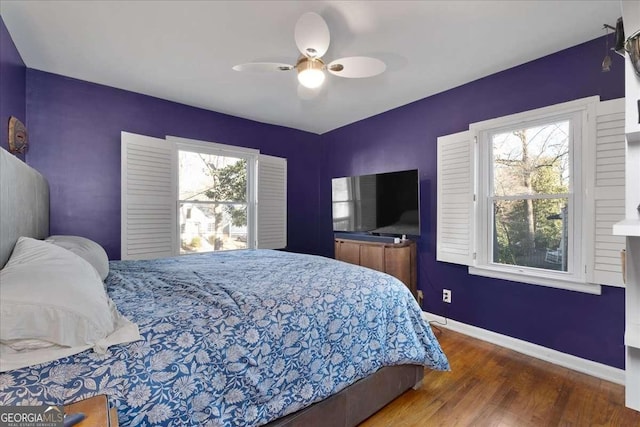 bedroom featuring ceiling fan and dark hardwood / wood-style floors