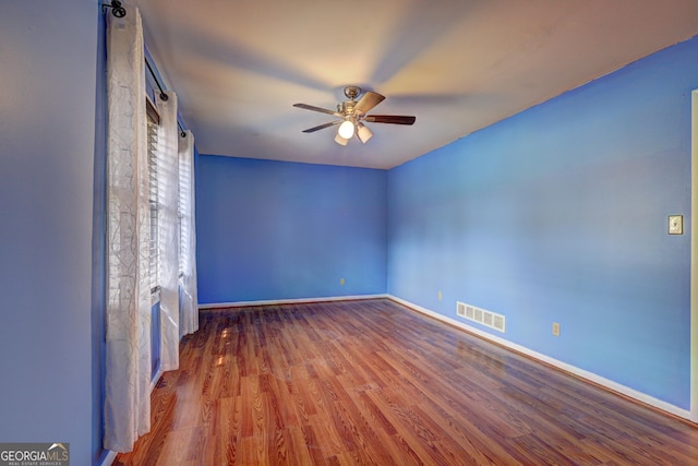 unfurnished bedroom featuring hardwood / wood-style floors and ceiling fan