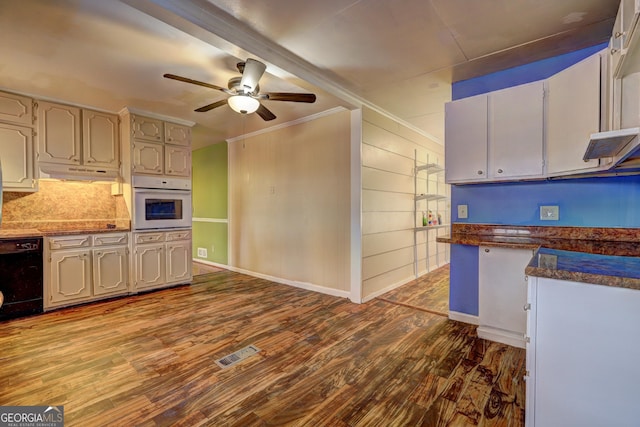 kitchen featuring dishwasher, ceiling fan, hardwood / wood-style floors, ornamental molding, and oven