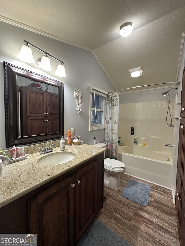 full bathroom with lofted ceiling, hardwood / wood-style flooring, vanity, toilet, and shower / bathtub combination with curtain