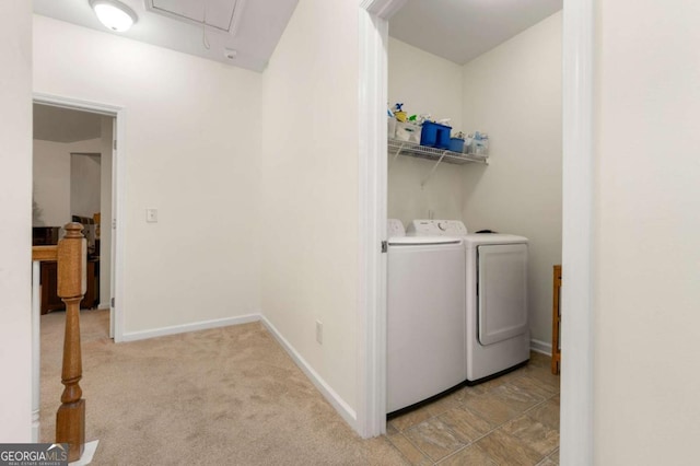 washroom with separate washer and dryer and light colored carpet