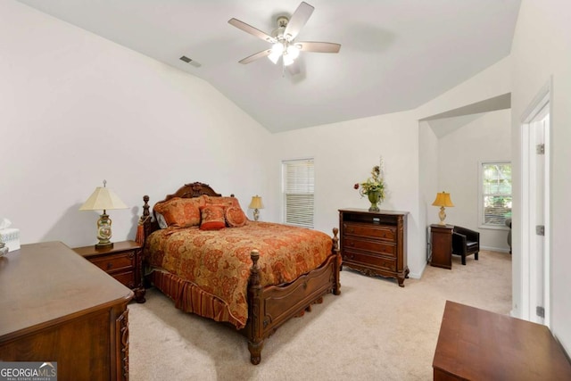 carpeted bedroom featuring ceiling fan and vaulted ceiling