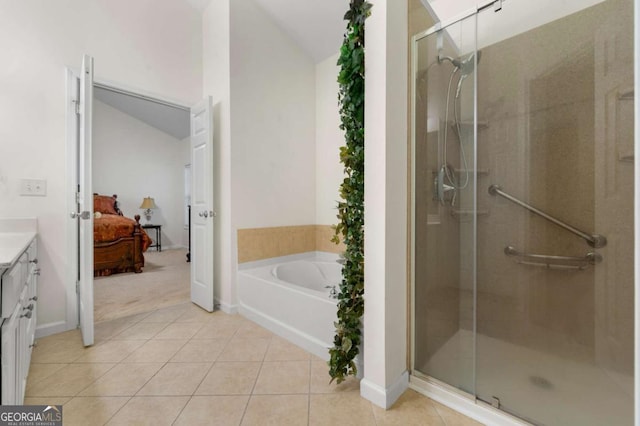 bathroom featuring vanity, separate shower and tub, and tile patterned flooring