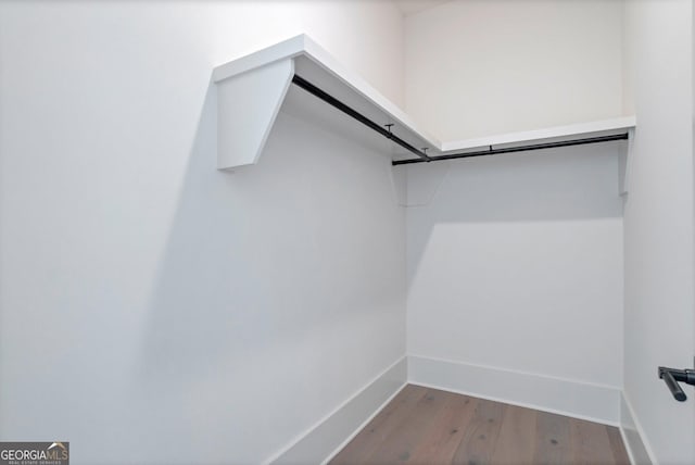 2819 Kestrel Dr, Statham, GA 30666 - walk in closet featuring wood finished floors