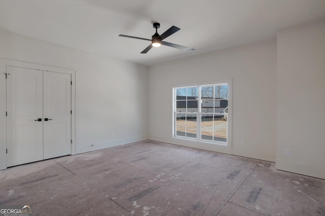 unfurnished room with ceiling fan