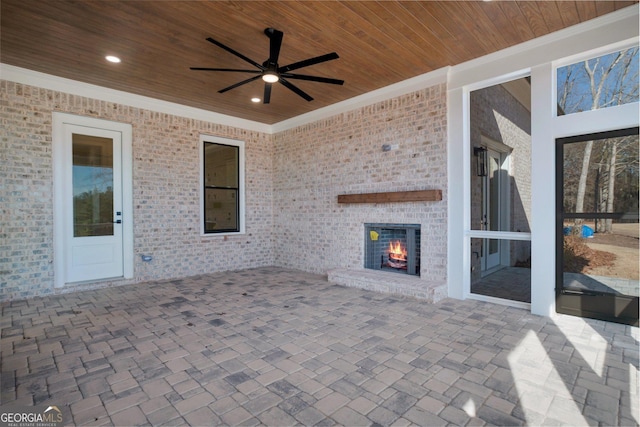 2819 Kestrel Dr, Statham, GA 30666 - view of patio / terrace with an outdoor brick fireplace and a ceiling fan