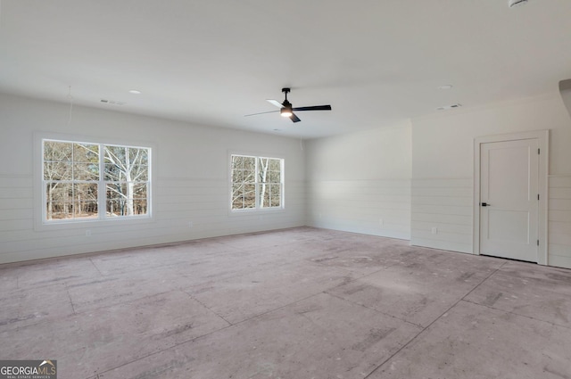 unfurnished room with ceiling fan