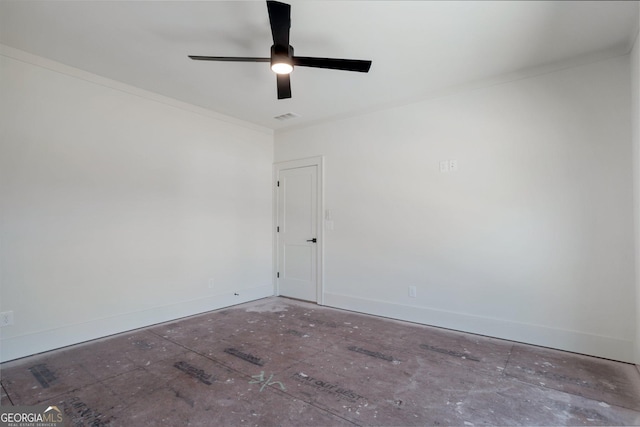 empty room featuring crown molding and ceiling fan