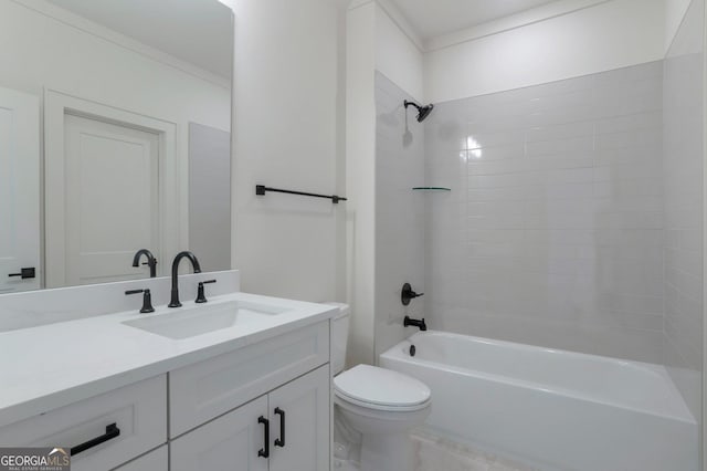 full bathroom with vanity, tiled shower / bath combo, and toilet