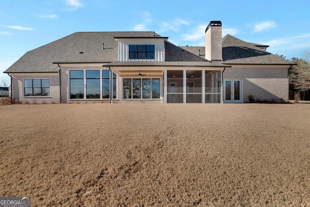 back of property featuring a sunroom and ceiling fan